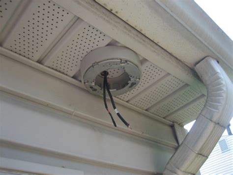 outdoor flood light junction box cover|installing flood lights vinyl soffit.